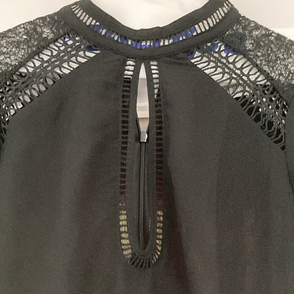 Feminine, long sleeve black top purchased at Saks Fifth Avenue. Sexy Look.